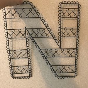 Black lightweight metal “N”